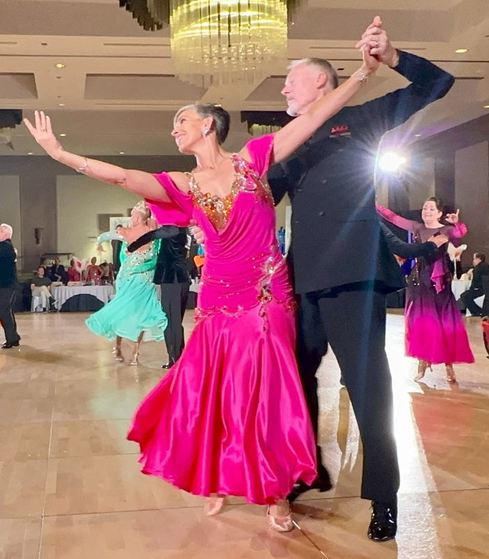 Mary in a pink gown on the competition floor